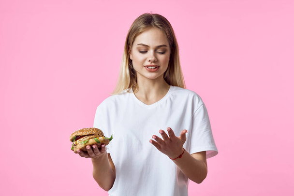 cute blonde in white t-shirt hamburger delicious food restaurant - Photo, Image