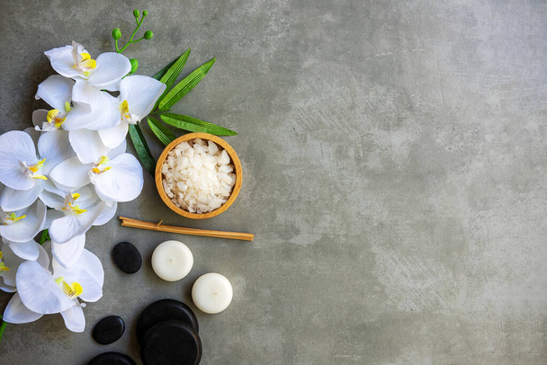 Thai Spa.  Massage spa and hot stones setting for treatment and relax with white orchid on blackboard.  Lifestyle Healthy Concept,  copy space for banner, top view - Fotoğraf, Görsel
