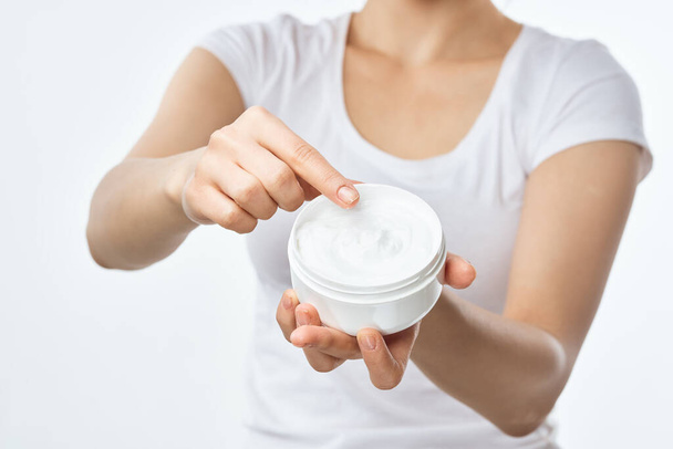 woman with cream in hands cosmetics hand skin care closeup - Zdjęcie, obraz