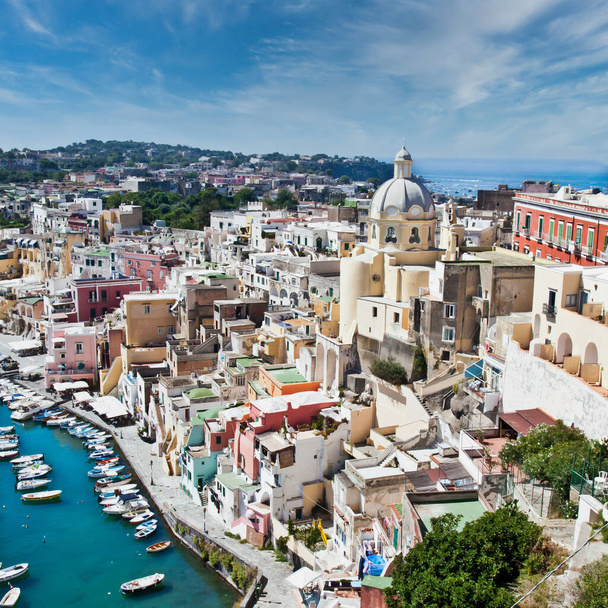 PROCIDA, ITALY - CIRCA AUGUST 2020: panoramic view of the mediterranean Italian island close to Naples in a summer day. - Fotografie, Obrázek