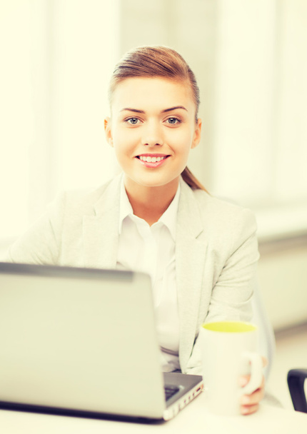 businesswoman with laptop in office - Photo, Image