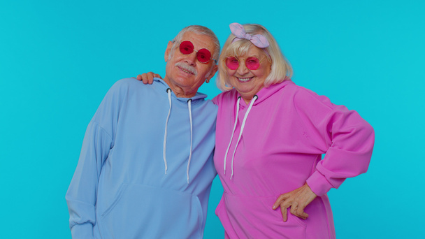 Seductive senior gray-haired stylish grandfather grandmother wearing sunglasses, charming smile - Photo, Image