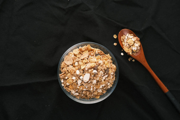  cereal breakfast in bowl on black background  - Valokuva, kuva