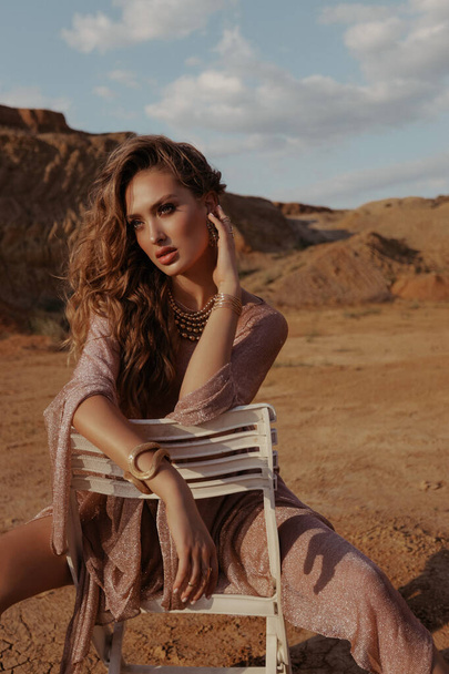 fashion outdoor photo of beautiful woman with blond hair in elegant clothes posing in desert  - Φωτογραφία, εικόνα