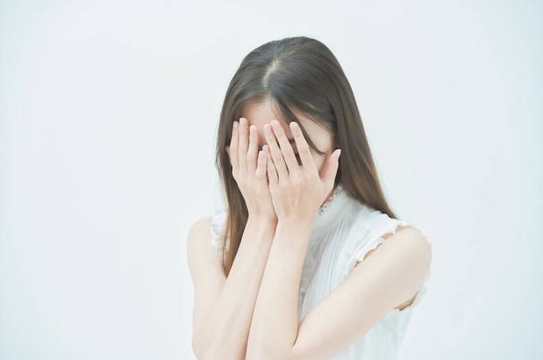 Asiática joven mujer con un estrés mirada - Foto, imagen