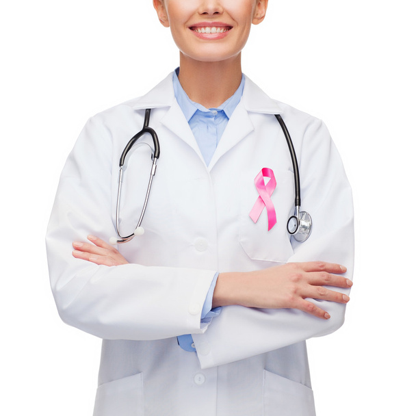 female doctor with breast cancer awareness ribbon - Фото, изображение