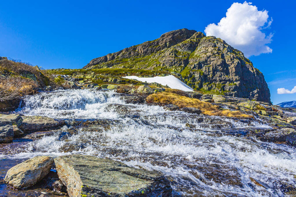 Amazing Storehodn mountain peak and rock formations cliffs at Veslehodn mountain by the Hydnefossen waterfall in Hemsedal Norway. - Photo, image