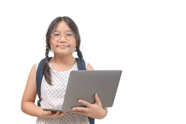 Cute girl student hold laptop isolated on white background, back to school and education concept - Photo, Image