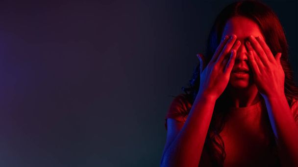 scared woman anxiety problem banner woman neon - 写真・画像