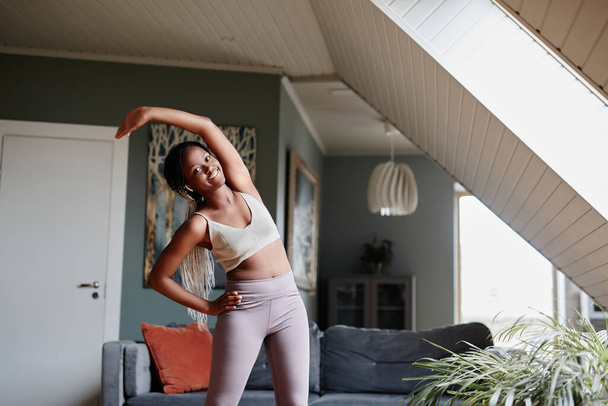 African American Woman Stretching at Home - Photo, Image