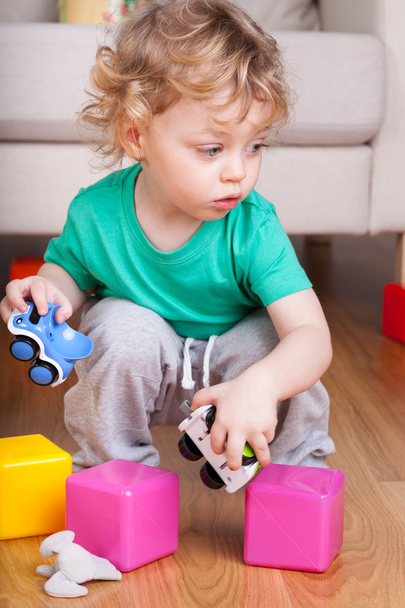 Child playing with toys - Fotografie, Obrázek