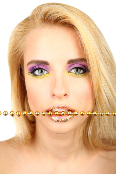 Beautiful woman with bright make-up and beads in teeth, close up - Foto, imagen