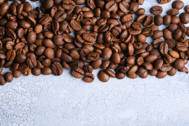 Coffee beans on color wooden background - Photo, image