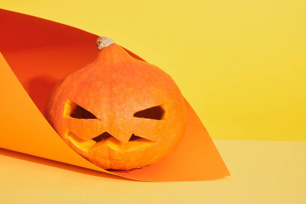 Halloween Pumpkin pumpkin jack lantern on yellow and orange background, copy space, halloween decoration concept - Photo, Image