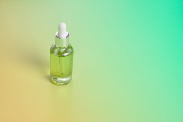 Dropper glass bottles with pipette. Transparent hyaluronic natural beauty mineral product and eco serum skin care concept. Top horizontal view copyspace. Summer juicy colors - Photo, Image