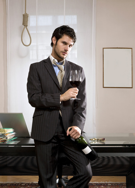 Businessman with wine and gallows - Foto, imagen