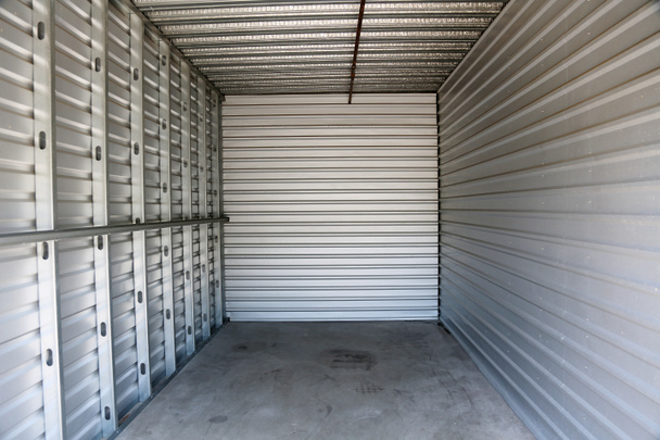 Storage Unit. Empty Storage Unit. mini storage building. self storage unit. empty garage. storage. garage. empty room. self storage.  - Photo, Image