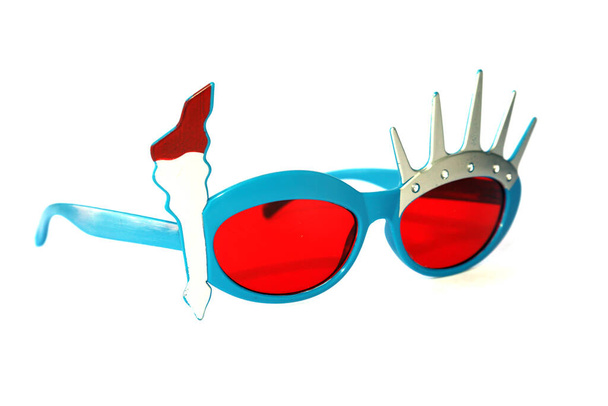 Statue of Liberty Sunglasses. Isolated on white. room for text. red lens 4th of july glasses. - Fotó, kép