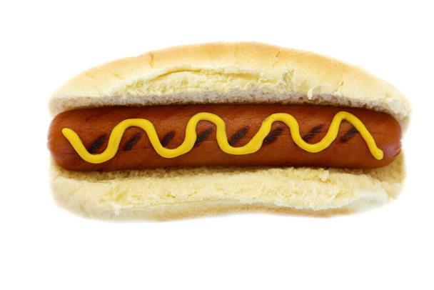 HOT DOG. Hot Dog with mustard. Isolated on white. Room for text. Hotdog in bun. - Photo, Image