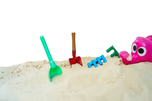 A closeup shot of sandbox toys on a white background - Fotó, kép