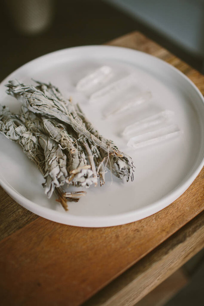 Several crystals and sage for meditation in a white plate - Fotó, kép