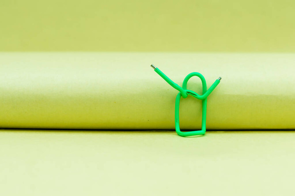 Hands in the air. Abstract Human Figure of Paper Clip. Creative Photography. Still life. Copy Space - Фото, изображение