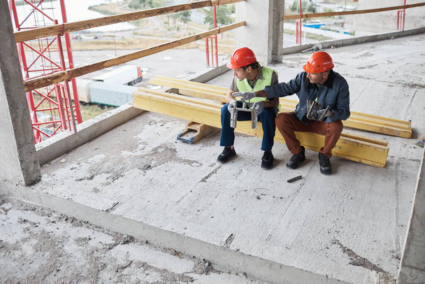 Workers Taking Break at Construction Site - Photo, Image