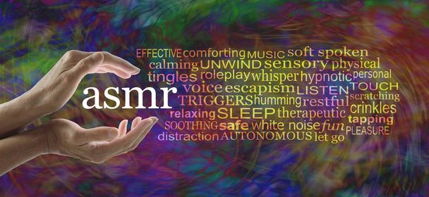 Words associated with the ASMR community word cloud - female hands cupped around ASMR beside a relevant word cloud against a vibrant churning swirling multicoloured modern abstract background - Photo, Image