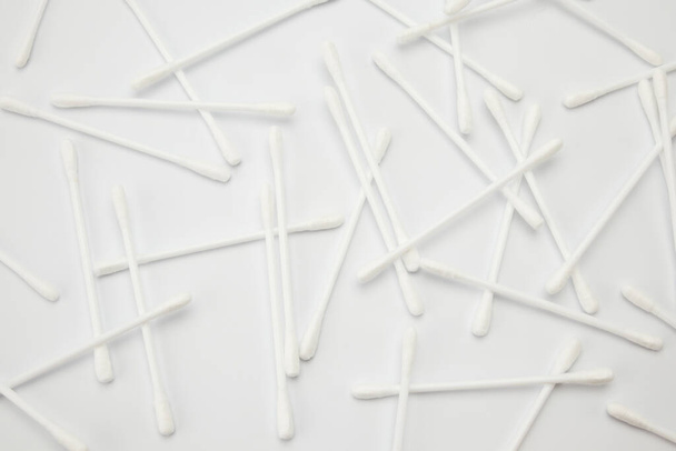 ear sticks are scattered on a white background - Photo, Image