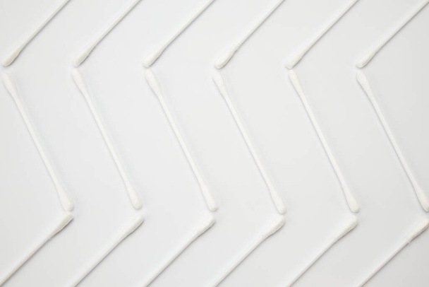 ear sticks are scattered on a white background - Foto, Imagem