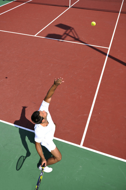 Young man play tennis outdoor - Foto, imagen
