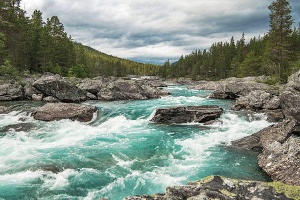 Rushing Scenic Turquoise River in Vestland County of Norway. Summer Landscape. - 写真・画像