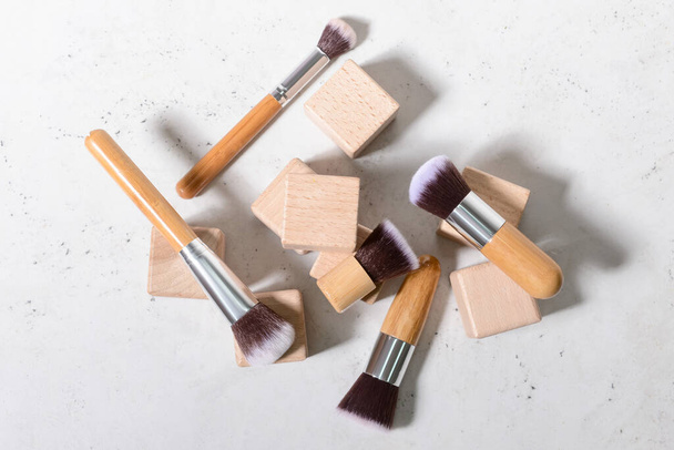 Set of makeup brushes with decor on white background - Photo, Image