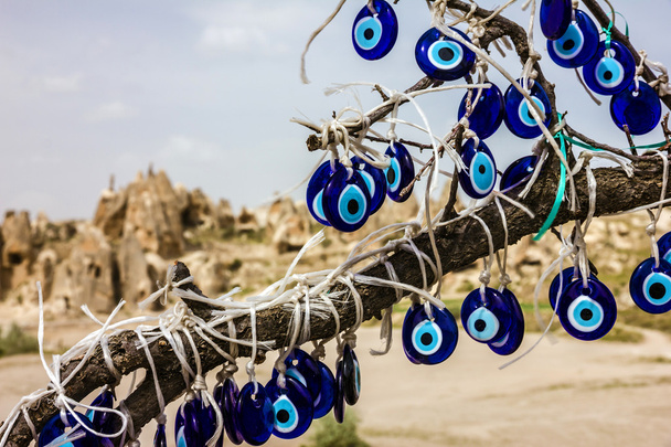Traditional blue evil eyes. Tree with popular Turkish souvenir. - Photo, Image