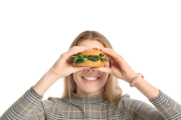 Jovem com saboroso hambúrguer vegan no fundo branco - Foto, Imagem