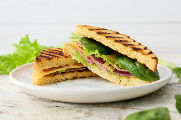Plate with tasty sandwiches on light background, closeup - Photo, Image