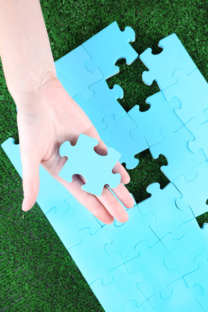 Hand holding puzzle piece - Photo, Image