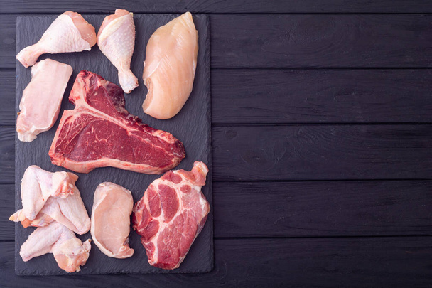 Assortment of raw meat . Chicken , beef steak and pork .  Cooking background - Foto, Imagen