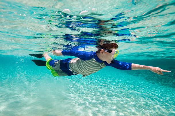 Boy swimming underwater - Fotoğraf, Görsel
