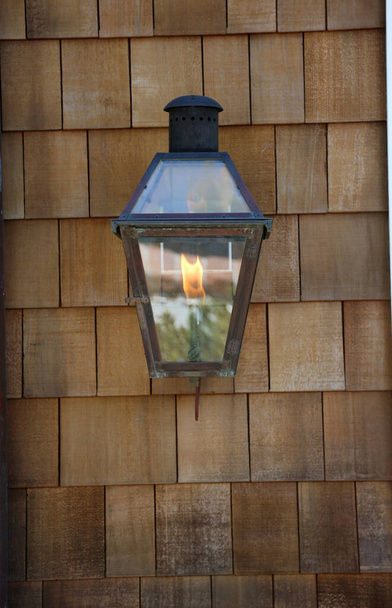 Gas Flame Porch Light on a Cedar Shake Wall. Cedar Shake. Cedar Shake Background. Wood Shake Wall. Backgrounds and Wallpapers. Room for text. - 写真・画像