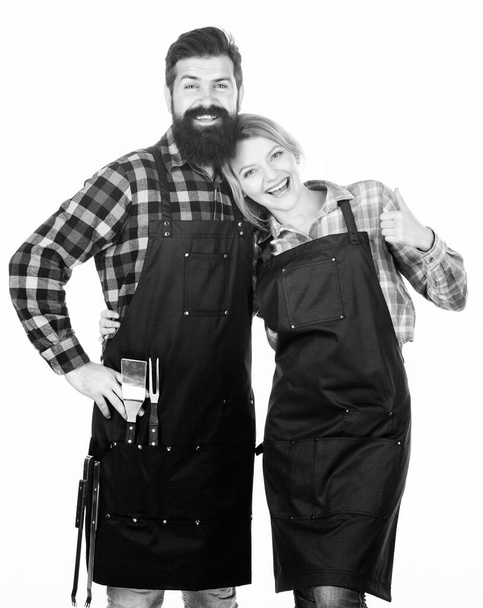 Cooking process. Tools for roasting meat. Man bearded hipster and girl. Preparation and culinary. Picnic barbecue. food cooking recipe. Couple in love hold kitchen utensils. Family weekend - Foto, Imagen