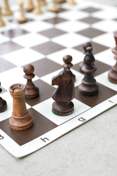 Chess Pieces standing on the Chessboard before the tournament. - Photo, image