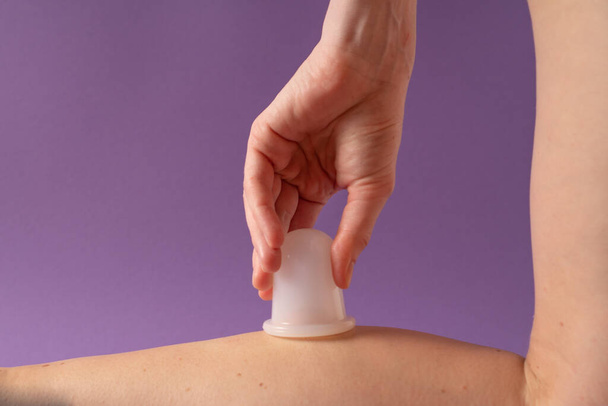 Anti-cellulite cupping therapy with a silicone jar. Anti Cellulite Cupping Massage. Leg massage. Vertical image - Photo, Image