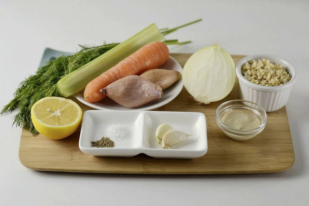 Prepare all the ingredients needed to make Greek Lemon Soup. - Фото, изображение