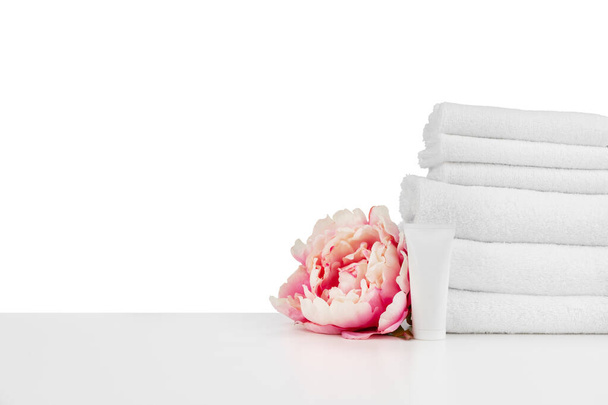 Spa composition with towels and flowers isolated on white - Фото, изображение