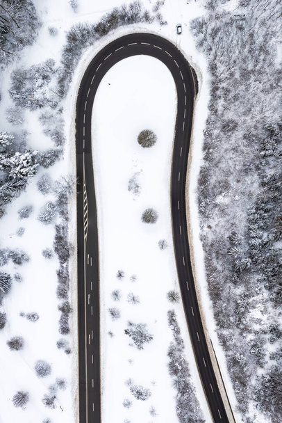 Winter snow winding road Serpentine season aerial photo view near Albstadt portrait format drone - Fotoğraf, Görsel