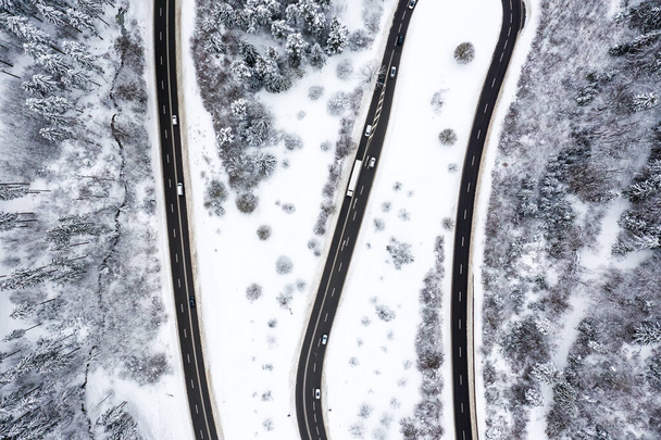 Winding road Serpentine Switchbacks winter snow season aerial photo drone - Photo, image