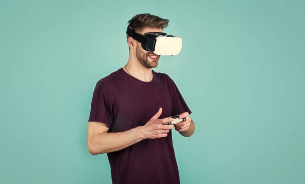Virtual work. Future technology concept. guy getting experience using VR-headset glasses. man wearing virtual reality goggles. game console using with VR headset. man with glasses of virtual reality - Foto, imagen