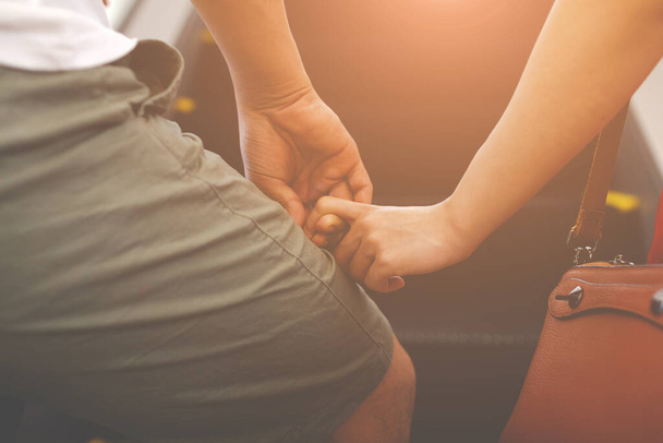 Love concept, Close up of man and woman holding hands - Photo, Image