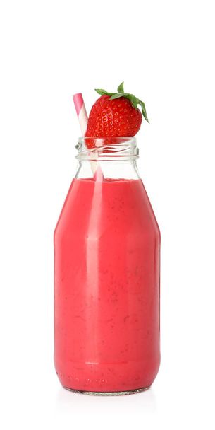Bottle of tasty strawberry smoothie isolated on white - Fotó, kép